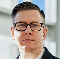 Porträt von Alexander Hughes als Führungskraft und CEO eines Unternehmens für Krypto-Trading